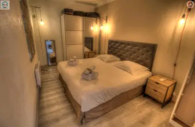 a bedroom with a bed with two stuffed animals on it at ALC - FF39 - 9 min Palais and Beaches in Cannes