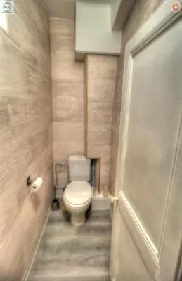 a small bathroom with a toilet and a door at ALC - FF39 - 9 min Palais and Beaches in Cannes