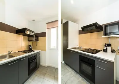 a kitchen with a sink and a stove top oven at Florella Achard Apartment in Cannes