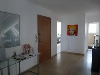 a living room with a table and a door at Two Bed apartment in a gated residence with gardens in Cannes with sea views 865 in Cannes
