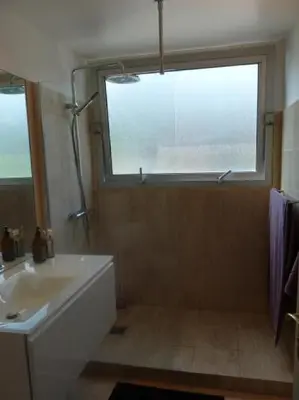 a bathroom with a tub and a sink and a window at Two Bed apartment in a gated residence with gardens in Cannes with sea views 865 in Cannes