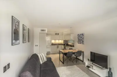a living room with a couch and a table at Modern 1-Bed Apt near Croisette Palais - 1903 in Cannes