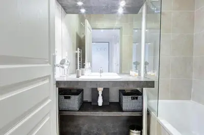 a bathroom with a sink and a shower at IMMOGROOM - 8 min from the Palais - AC - Quai St Pierre in Cannes