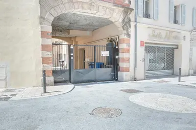 an entrance to a building with a black gate at IMMOGROOM - 8 min from the Palais - AC - Quai St Pierre in Cannes