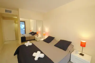 a bedroom with two beds with white crosses on them at Residence Gray d'Albion 2P ALI1165 in Cannes