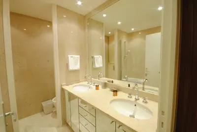 a bathroom with two sinks and a large mirror at Residence Gray d'Albion 2P ALI1165 in Cannes