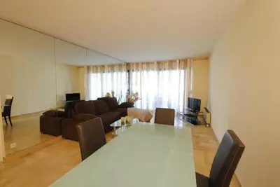 a living room with a table and a couch at Residence Gray d'Albion 2P ALI1165 in Cannes