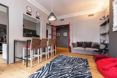 a living room with a couch and a table at Travel lodge in Cannes