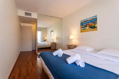 a bedroom with two beds with towels on them at Residence Gray d'Albion 2P BLA584 in Cannes