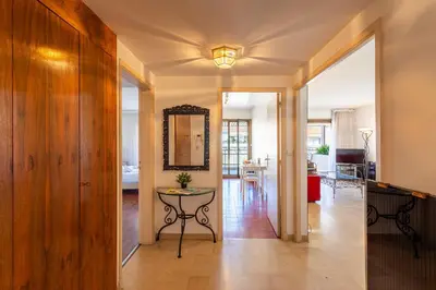 a hallway with a table and a living room at Residence Gray d'Albion 2P BLA584 in Cannes