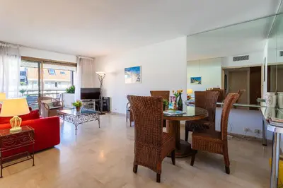 a living room with a table and chairs at Residence Gray d'Albion 2P BLA584 in Cannes