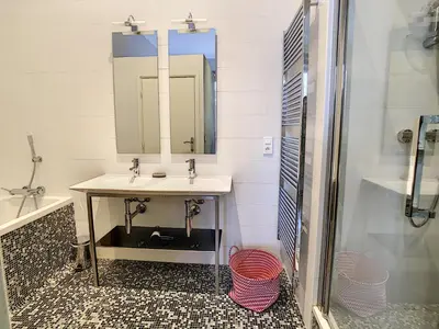 a bathroom with a sink and a mirror at Le Cid 3P CIR3374 in Cannes