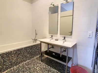 a bathroom with a sink and a mirror at Le Cid 3P CIR3374 in Cannes