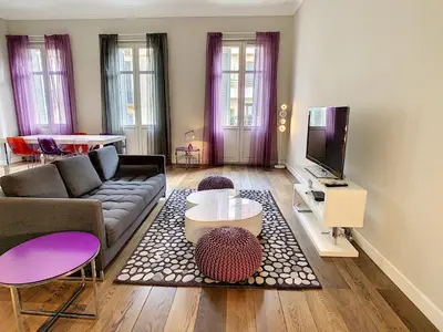 a living room with a couch and a tv at Le Cid 3P CIR3374 in Cannes