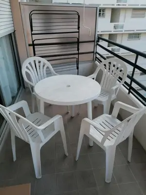 a white table and chairs on a balcony at Palais Rouaze 2P SOM2151 in Cannes