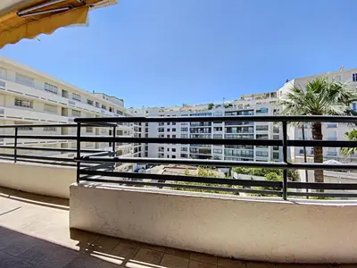 a balcony with a view of a building at Palais Rouaze 2P SOM2151 in Cannes