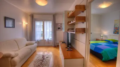 a living room with a couch and a bed at 2 Pièces 57 Rue d'Antibes proche Palais in Cannes