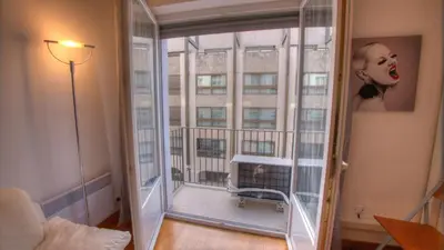 a room with a window with a view of a building at 2 Pièces 57 Rue d'Antibes proche Palais in Cannes