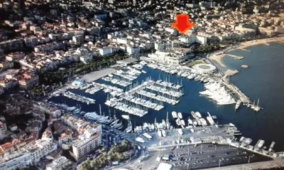 an aerial view of a marina with a red arrow at 2 Pièces 57 Rue d'Antibes proche Palais in Cannes