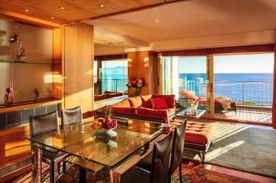 a living room with a table and a couch at Rabelais in Cannes