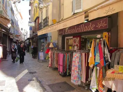a street with a shop with clothes on display at Studio Elly in Cannes