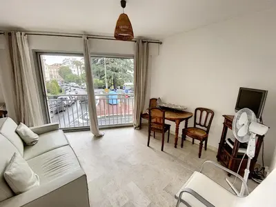 a living room with a couch and a table at Palm d'Or KAR146 2P in Cannes