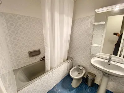 a bathroom with a sink and a tub and a toilet at Palm d'Or KAR146 2P in Cannes