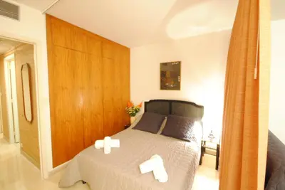 a bedroom with a bed with two crosses on it at Gray d'Albion studio BON500 in Cannes