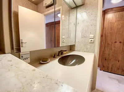a bathroom with a sink and a mirror at Gray d'Albion studio BON500 in Cannes
