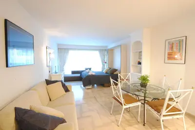 a living room with a couch and a glass table at Residence Gray d'Albion Studio DEL186 in Cannes