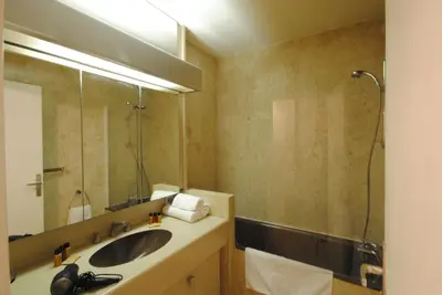a bathroom with a sink and a shower and a mirror at Residence Gray d'Albion Studio DEL186 in Cannes