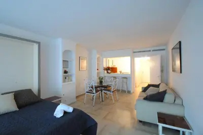a bedroom with a bed and a couch and a table at Residence Gray d'Albion Studio DEL186 in Cannes