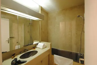 a bathroom with a sink and a shower and a mirror at Residence Gray d'Albion Studio DEL186 in Cannes