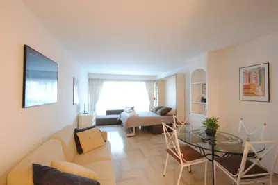 a living room with a couch and a table at Residence Gray d'Albion Studio DEL186 in Cannes