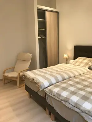 a bedroom with two beds and a chair in it at Cannes center in Cannes