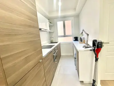 a small kitchen with a sink and a counter at Pasteur by Welcome to Cannes in Cannes