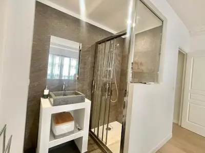 a bathroom with a shower and a sink and a toilet at Pasteur by Welcome to Cannes in Cannes