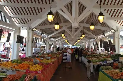 a market with many fruits and vegetables on display at les orangers in Cannes