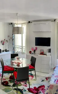 a bottle of wine and a glass on a table at Cannes Apartment close to Congress Palace, Croisette, Beaches in Cannes