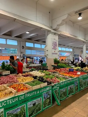 a market with lots of fruits and vegetables on display at Cannes Apartment close to Congress Palace, Croisette, Beaches in Cannes