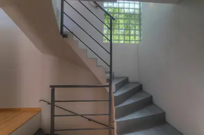 a staircase in a house with a window at IMMOGROOM - Beautiful duplex - Sea view - Quiet - AC - Wifi - Garage in Cannes