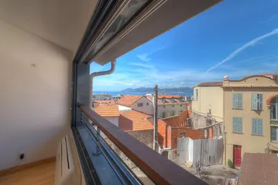 a view from a window of a city at IMMOGROOM - Beautiful duplex - Sea view - Quiet - AC - Wifi - Garage in Cannes