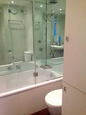 a bathroom with a tub and a toilet and a shower at Residence Saint Marc in Cannes