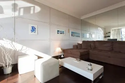 a living room with a couch and a coffee table at Residence Saint Marc in Cannes