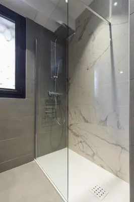 a bathroom with a sink and a toilet and a window at Résidence Vue Mer Cannes in Cannes