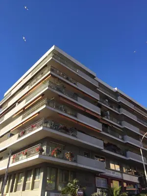 a tall apartment building with balconies on it at AGENCIA appartement 2 chambres au Suquet in Cannes
