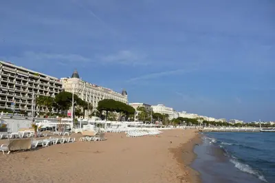 a building with a large sign on the side of it at Appartement Palais des Festivals in Cannes