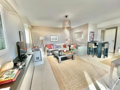 a living room with a couch and a table at Bristol by Welcome to Cannes in Cannes