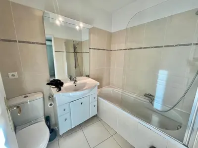 a bathroom with a sink and a toilet and a tub at Bristol by Welcome to Cannes in Cannes
