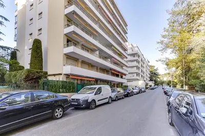 a row of cars parked in front of a building at IMMOGROOM - Renovated apartment - Terrace - AC - Wifi in Cannes